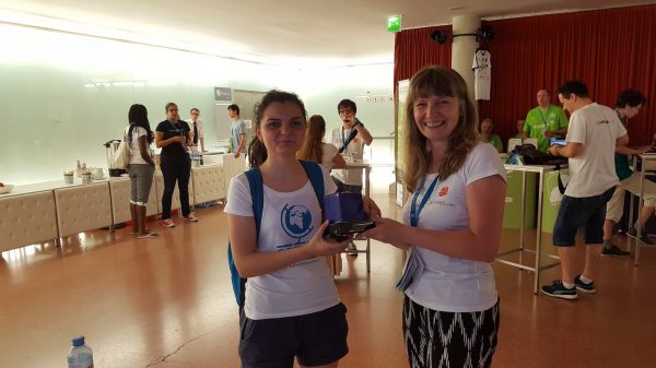 Agnes and one of our users receiving a prize