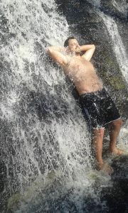 Adriano relaxing his mind and body at a waterfall near to his place